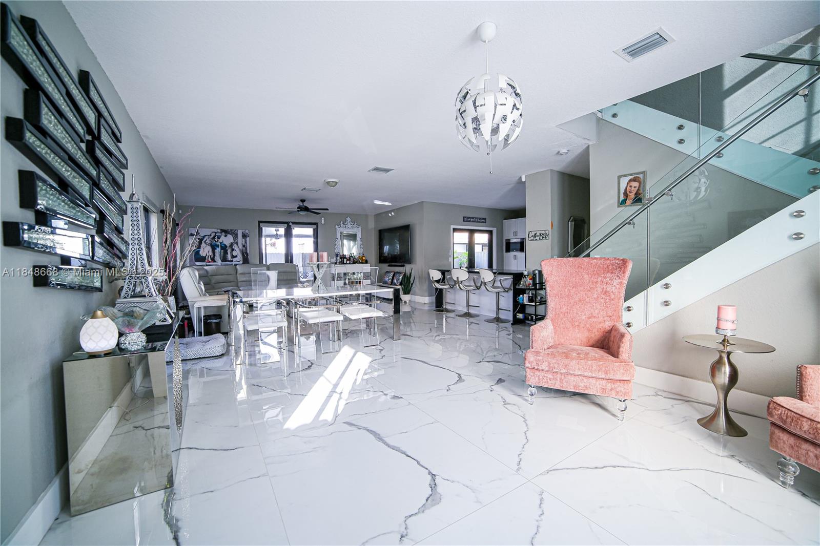 Only 2 months moves you in. Welcome to this exquisite 5bd / 4bath home offering both luxury & convenience! As you step inside, you'll be greeted by stunning white & gray porcelain tile throughout. The kitchen is highlighted by a beautiful granite waterfall countertop, & S/S appliances. This open layout provides easy access to the dining & living room, making it an ideal space for entertaining family & friends. You'll find 2 bd on the 1st floor, including a jr. suite. As you ascend the staircase, adorned with luxurious black marble flooring & sleek glass railing, you'll discover the Main rm which includes a bath w/ a stand-up shower, jacuzzi, dual sinks, & walk-in closets. Let’s Make this your Home! EASY TO SHOW.