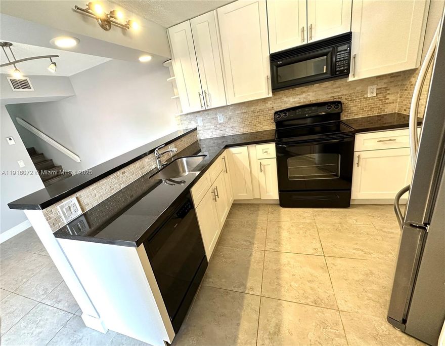 Beautifully remodeled and updated 2 bed 2.5 bath home located in an excellent neighborhood-Boca Rio. The unit comes complete with a washer and dryer. Granite countertops throughout the entire kitchen as well as stainless steel appliances.