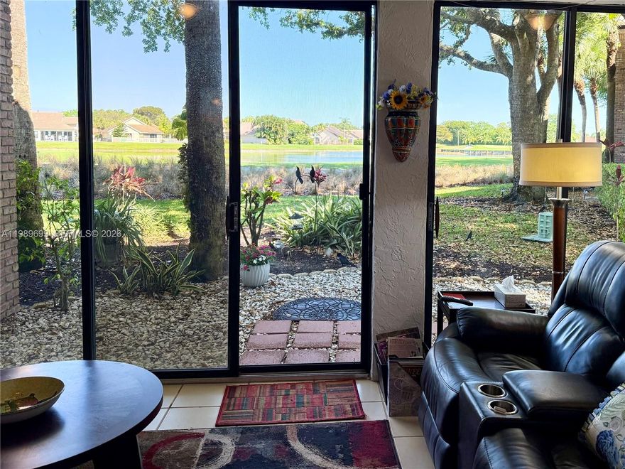 Experience panoramic golf and lake views from this rare corner residence in Aberdeen Golf & Country Club. Designed for natural light and seamless indoor-outdoor living, this home features oversized windows, elevated ceilings, and a glass-enclosed lanai that creates a year-round space to relax and enjoy the scenery.

The open kitchen is positioned to capture the tranquil fairway and water views, complete with quartz countertops, white cabinetry, and a spacious breakfast bar that flows into the main living area. The primary suite offers a large walk-in closet and picturesque views. Hard flooring runs throughout with no carpet, creating a clean and low-maintenance interior.

Recent updates include a brand new A/C, hot water heater, and stacked washer & dryer. First-floor access & parking directly in front of the unit add everyday convenience, with guest parking nearby. The building has also been recently painted & features a newer roof.

Located within exclusive Aberdeen Golf & Country Club, a mandatory membership community, residents enjoy access to Jim Fazio-designed golf course, tennis, pickleball, resort-style pools, a state-of-the-art fitness and aquatics center, and multiple dining venues. A vibrant social calendar creates an active, connected lifestyle.

Situated within an A-rated school zone & set across 1,400 acres of beautifully maintained grounds, Aberdeen offers a rare opportunity to enjoy true country club living at a compelling value in Palm Beach County.