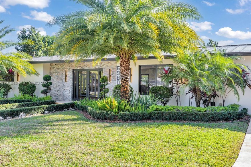 Welcome to this beautifully renovated corner-lot home in Plantation, ideally located between Miami and Fort Lauderdale. Situated on a quiet cul-de-sac with over 12,000 sq ft of land, this property offers no HOA, allowing parking for a boat, RV, or work vehicle.This 3-bedroom, 2-bathroom residence has been completely updated with high-end finishes, including a new metal roof, hurricane-impact windows and doors, and a renovated heated pool. The modern kitchen features Sub-Zero and Miele appliances, custom cabinetry, and an oversized waterfall island. Additional highlights include spa-style baths, fireplace, surround sound, a well-appointed laundry room, and a two-car garage. Please see offer guidelines and 24 hour required.