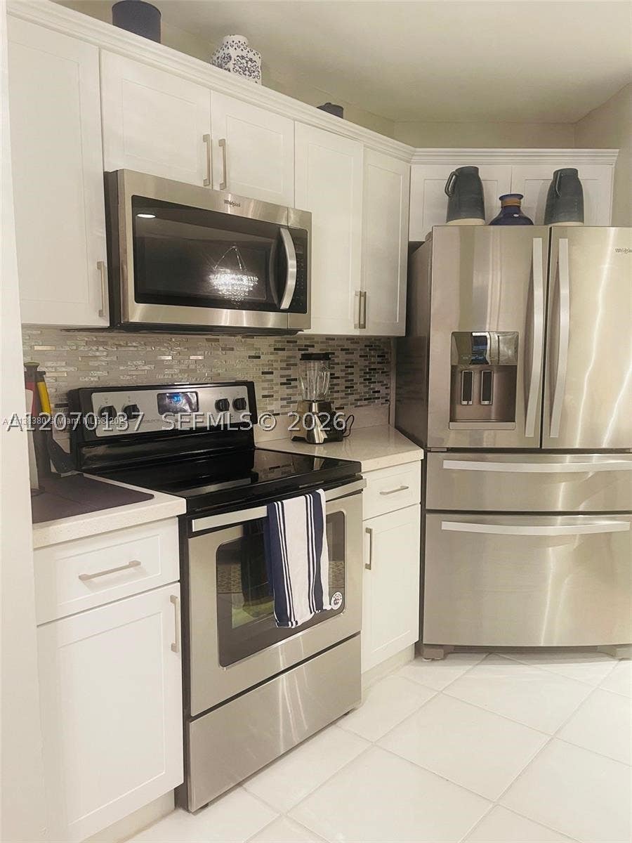 Photo of 10551 W Broward Blvd #111, Plantation, FL 33324 (MLS # A12070137)