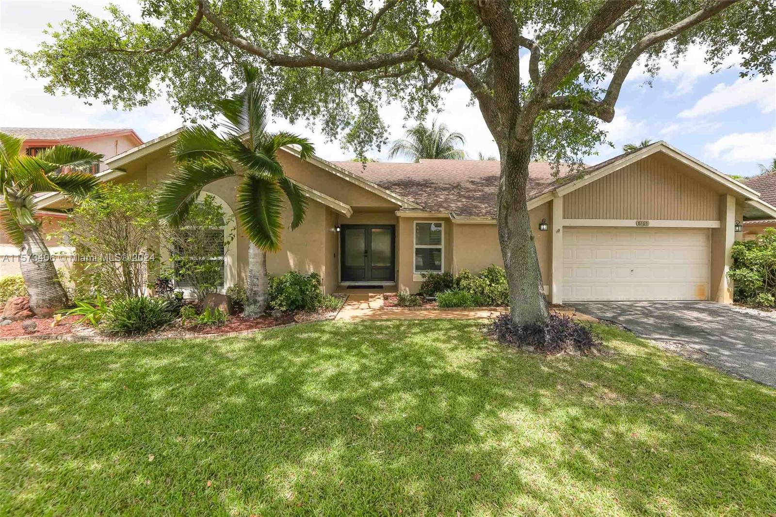 Welcome home to this charming 3 bedroom, 2 bathroom residence in Cooper City! Boasting an upgraded, white kitchen featuring granite countertops, stainless steel appliances and coffee bar. Other features include a modern primary bathroom, sleek blinds, bamboo floors and plantation shutters as well as built-ins.
You'll find peace of mind with the *hurricane impact windows and doors installed in 2020*, along with a 2020 air conditioner. The yard is spacious and private with room for a pool and also has a mango tree. The garage was converted into a 4th bedroom and can easily be reversed for those who prefer a full garage.
Your kids will love being walking distance to the park, middle school and highschool. Enjoy the Cooper City A rated school district. Bonus...NO HOA!