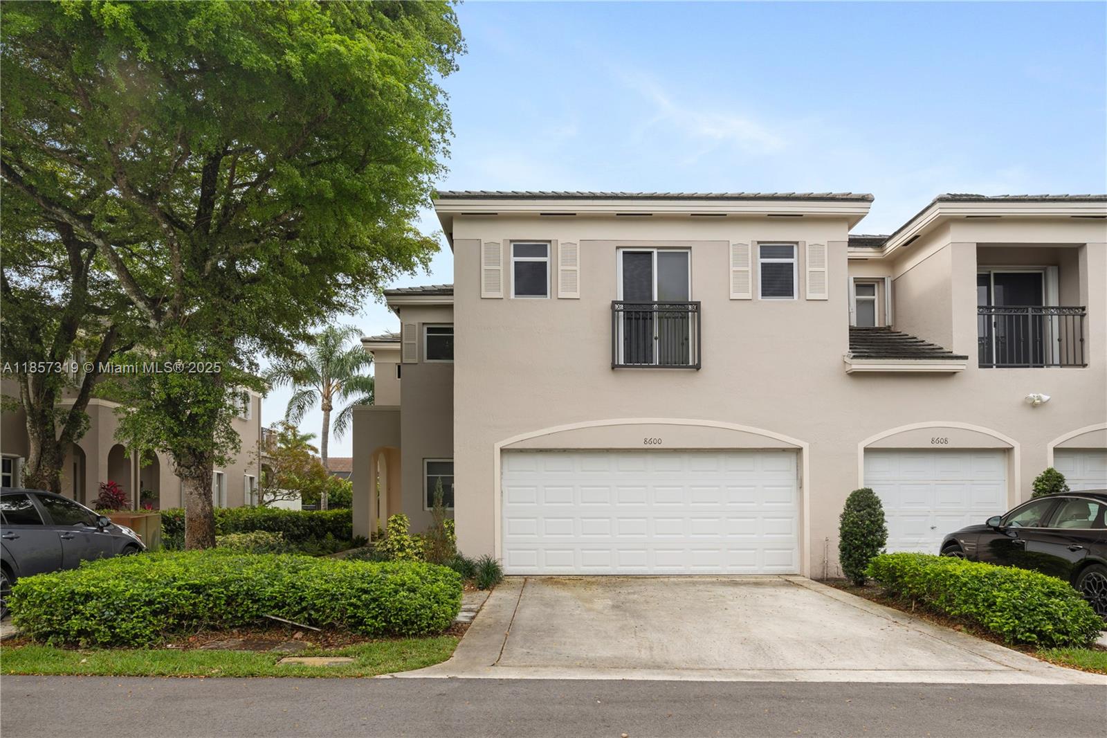 Nestled in the northern reaches of Palmetto Bay, this expansive 2,600 sq ft townhome boasts a chic and comprehensive renovation. The impressive primary suite is complete with a spacious walk-in closet and tranquil canal views. Upstairs, the additional bedrooms are amply proportioned, basking in natural light. The kitchen's open design is enhanced by granite countertops and stainless-steel appliances and is beautifully paired with the first floor's sleek porcelain tile and the upper level's warm wooden floors. The ground floor features a vast great room, a den/office with an adjoining full bathroom, and a two-car garage. Residents enjoy serene canal vistas and community amenities such as a swimming pool and guest parking, all within the comfort of a secure gated neighborhood.