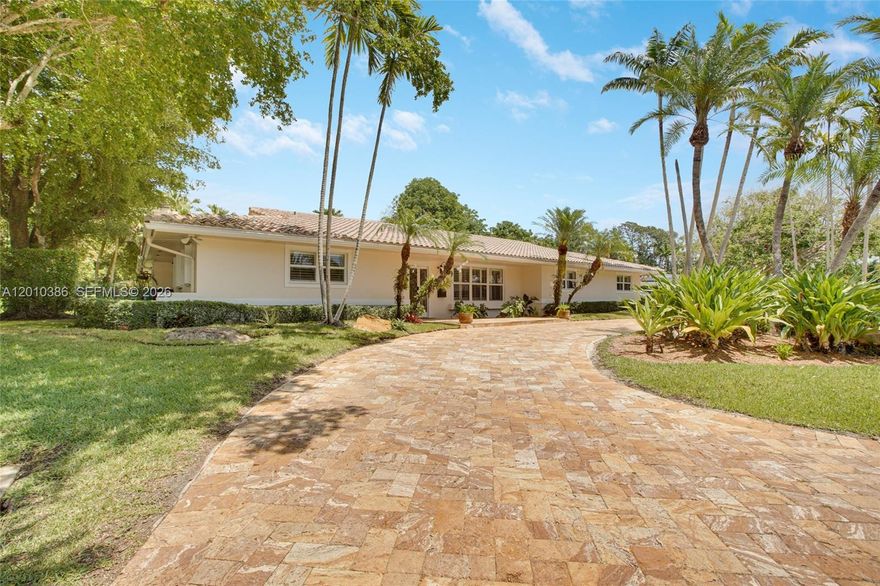 Perfectly positioned at the entrance of a quiet cul-de-sac in one of South Florida’s most established neighborhoods, this timeless single-story residence offers a rare blend of privacy, presence, and long-term opportunity. Zoned for A-rated Palmetto Elementary School, Palmetto Middle School, and Miami Palmetto Senior High School, the location is anchored in one of the region’s most sought-after school districts.

Set on an expansive 18,079 SF lot in the heart of Pinecrest, this 3,448 SF home offers 5 bedrooms, including a dedicated office, and 4 fully renovated bathrooms. A 2024 partial kitchen renovation enhances the home’s natural flow, opening to bright living spaces and an inviting outdoor retreat with pool and covered patio—ideal for effortless indoor-outdoor Florida living.

Designed for comfort and peace of mind, the home features impact windows on the front façade and accordion shutters throughout the remaining openings, providing valuable storm protection and security. Additional highlights include a spacious laundry room with secondary refrigeration and a versatile storage shed.

A rare opportunity for international and relocating buyers seeking immediate livability with long-term upside, or end users envisioning a future estate transformation in a highly desirable Pinecrest setting. Quiet streets, premier schools, strong land value, and lifestyle converge in one exceptional address.