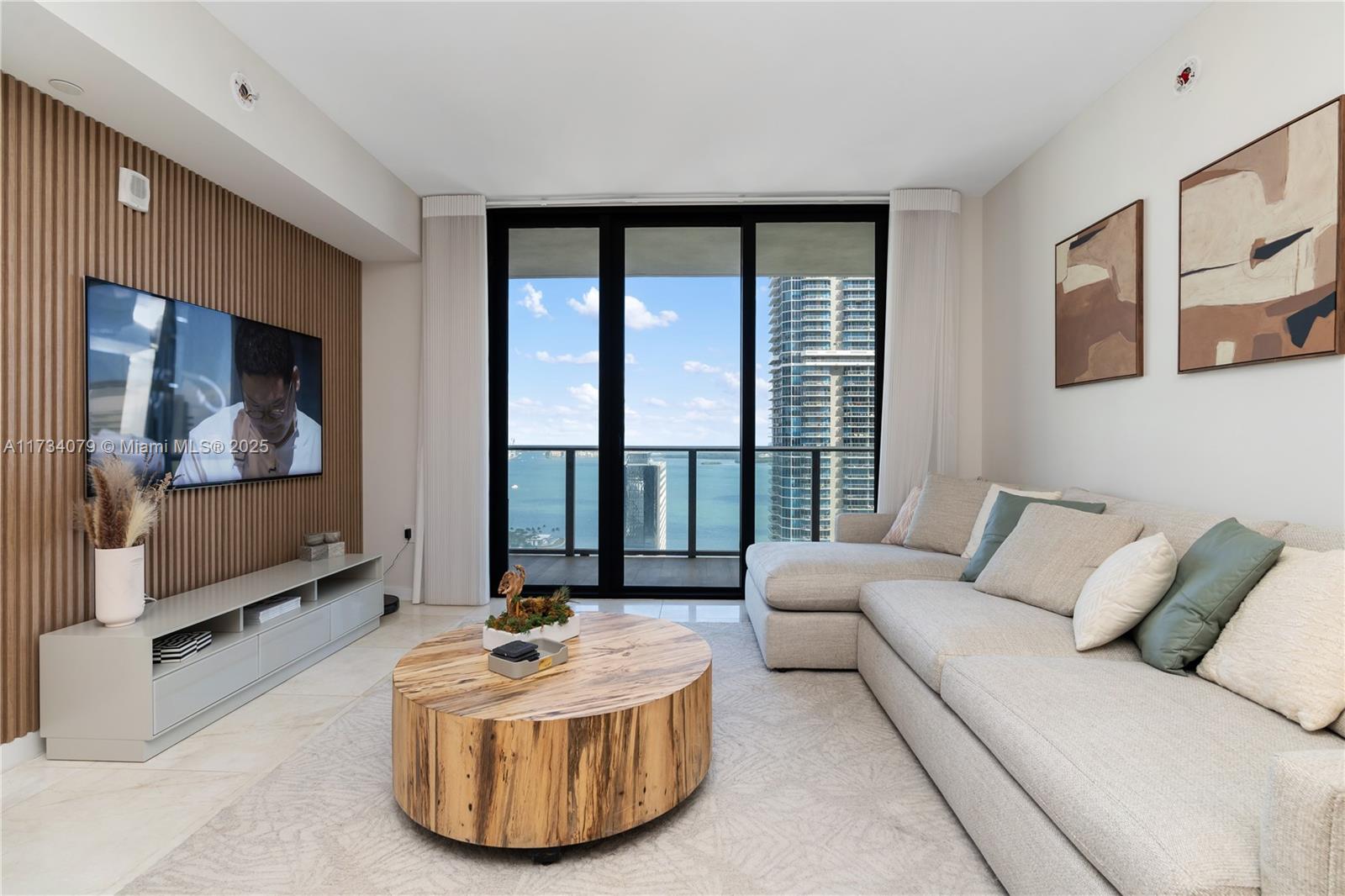 Come see your future home on the 40th floor in the heart of Brickell. This exquisite 2-bedroom + den, 3-bathroom apartment at 1010 Brickell offers breathtaking water views and unparalleled luxury. Styled by an interior designer, the unit boasts top-of-the-line finishes, Smeg appliances, and custom closets for optimal storage and elegance. Enjoy electric blackouts and roller shades, while a private elevator grants exclusive access. Ideally located between Brickell Ave and Miami Ave, you’re steps from Brickell City Centre, gourmet restaurants, and high-end shopping. The building offers resort-style amenities, including pools, a fitness center, a running track, and more, ensuring a sophisticated urban lifestyle in one of Miami’s most sought-after locations.