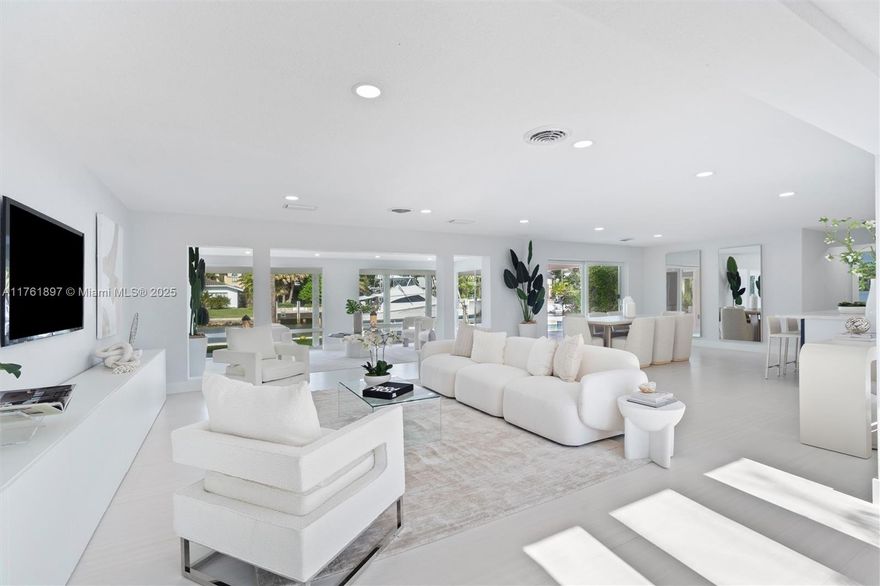 Experience the ultimate waterfront lifestyle in this stunningly remodeled 4-bedroom, 4.5-bathroom. Boasting 94 feet of deep-water frontage on a wide canal, this residence is a boater’s dream, just minutes from the Hillsboro Inlet. 
Situated on an expansive 10,000+ sq. ft. lot, the home features a heated pool, offering a private oasis for relaxation. The spacious primary suite includes his-and-hers walk-in closets and seamless access to the backyard. The kitchen shines with new stainless steel appliances and quartz countertops, perfect for culinary enthusiasts.
Additional highlights include impact windows, a secluded laundry room, and an open-concept design ideal for entertaining. Whether you’re an avid boater or seeking luxury waterfront living, this exceptional home is a rare find!