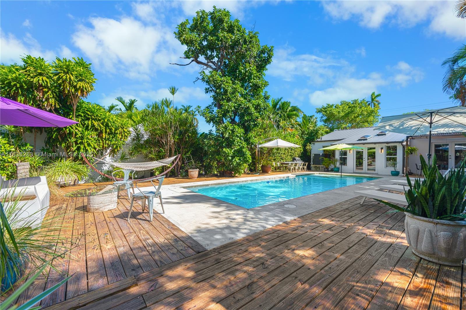 Priced to sell fast - Live in the heart of Miami Beach on beautiful Royal Palm Avenue in this tastefully updated 1936 pool home. Featuring welcoming living areas with separate living & dining areas, abundant natural light, great curb appeal, open eat-in kitchen, plus a stunning backyard with heated pool and lush landscaping. Ideal for both a quiet retreat and hosting/entertaining. Other highlights include 3BD/3BA split floor plan, large primary w/ walk-in closet, glazed porcelain floors, impact windows & doors throughout, additional family/sun room, roof replaced 2018, plus wooden deck & covered pergola. Don’t miss this amazing opportunity in one of Miami Beach’s most sought-after neighborhoods.