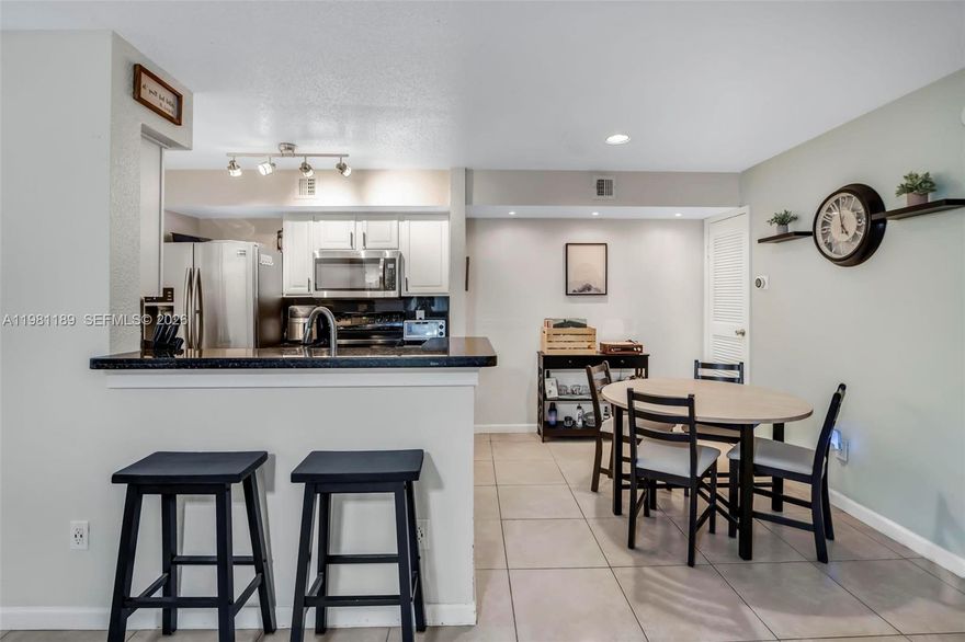 Welcome to this first floor 2-bedroom, 2-bathroom condo in the heart of Coral Springs, offering comfort, style, and convenience. This well-maintained home features tile flooring throughout, creating a clean and cohesive living space that’s both elegant and easy to maintain. The updated kitchen is designed for both functionality and style, showcasing granite countertops, stainless steel appliances, and ample cabinet space, perfect for everyday living or entertaining guests. The split bedroom layout flows seamlessly into the living and dining areas, providing a spacious feeling. Both bathrooms have been tastefully updated, adding a modern touch to the home. The generously sized bedrooms offer plenty of space and comfort, while the in-unit washer and dryer provide added convenience. Equipped with impact windows and doors for added safety. Ideally located near shopping, dining, parks, and major roadways, this condo is a fantastic opportunity for buyers looking to enjoy everything Coral Springs living has to offer or investors looking for a great opportunity as you can rent immediately.