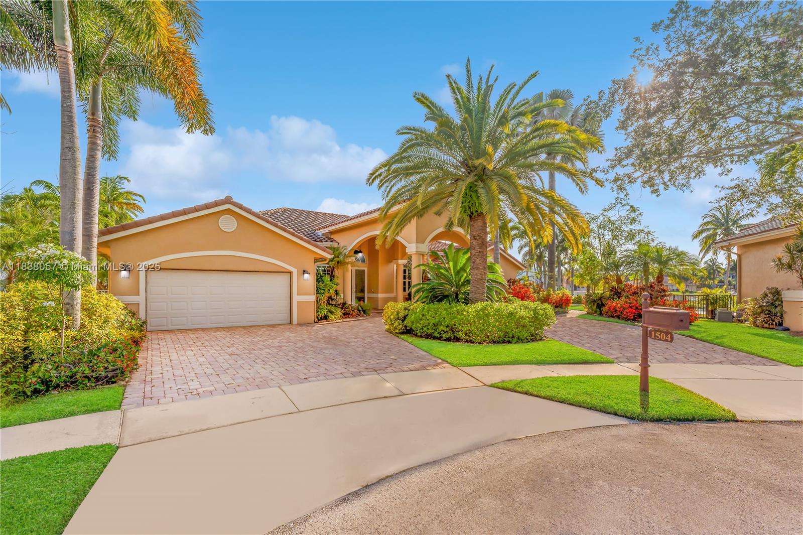 Own a truly one-of-a-kind custom-built estate on a premier waterfront point lot offering the ultimate in privacy, elegance and resort-style living. This outdoor oasis is an entertainer’s dream with a summer kitchen, private golf putting green, resort-style pool and lush landscaping. Inside enjoy marble flooring, soaring vaulted ceilings, a chef’s kitchen with Craft Maid cabinetry, top-of-the-line appliances, custom fireplace, sophisticated built-ins with wet bar and tastefully updated bathrooms. The owner’s suite is a private retreat with bay windows framing tranquil water views. Impact glass, a 3-zone A/C system and a whole-home gas generator with new battery ensure comfort and security year-round. A rare blend of timeless craftsmanship and modern luxury offering an unparalleled lifestyle