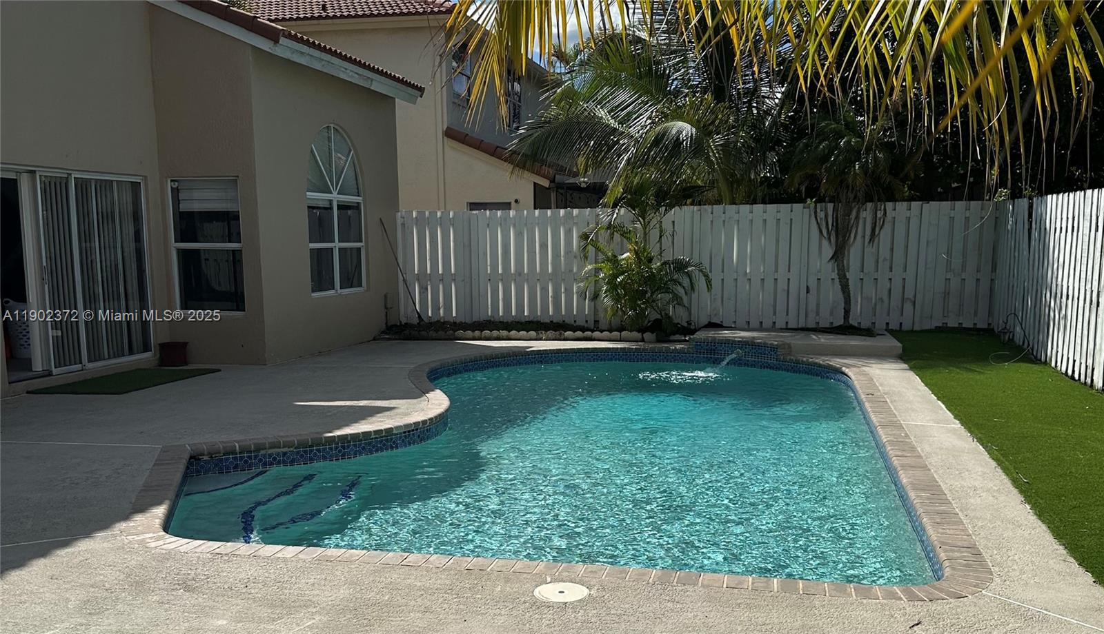 Undervalued and priced for a fast sale! This beautiful 4-bedroom, 2.5-bath home is nestled in one of the most sought-after neighborhoods, just minutes from the popular Sawgrass Mills Mall, and major highways. Enjoy peace of mind with a new roof installed just 2 years ago and a sparkling pool recently resurfaced, perfect for year-round enjoyment. This spacious residence features a bright, open layout with generous living areas and comfortable bedrooms, ideal for both family living and entertaining. Some upgrades are being completed before closing, adding even more value to this move-in-ready gem. Don’t miss your chance to own this incredible home at an unbeatable price — schedule your private showing today!