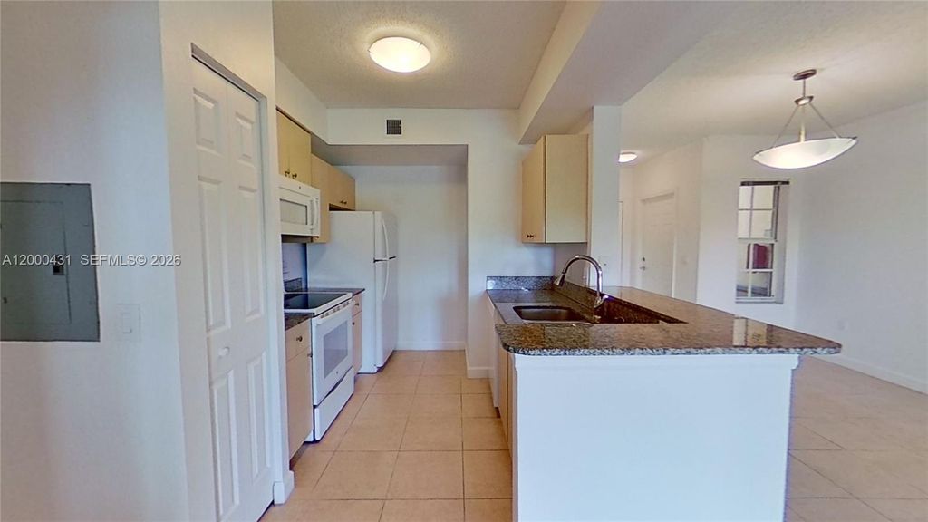 Photo of 2493 Centergate Dr #103, Miramar, FL 33025 (MLS # A12000431)