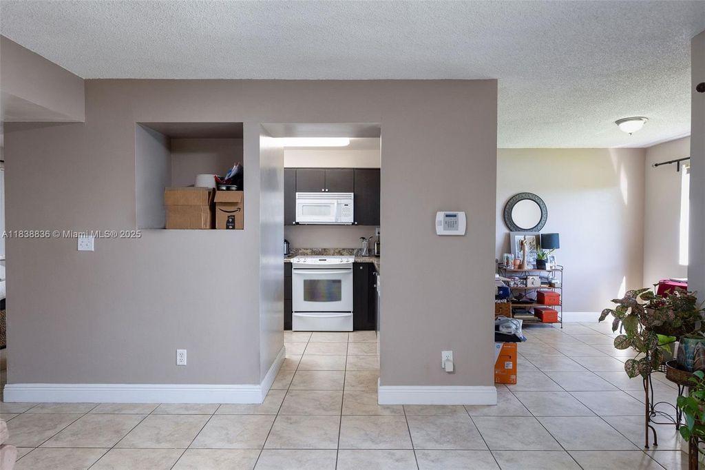 Photo of 706 NW 92nd Ave #706, Plantation, FL 33324 (MLS # A11838836)