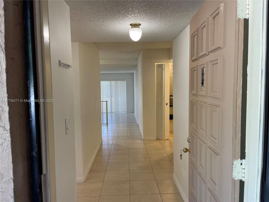 Photo of 2700 Coral Springs Dr #103, Coral Springs, FL 33065 (MLS # A11779471)