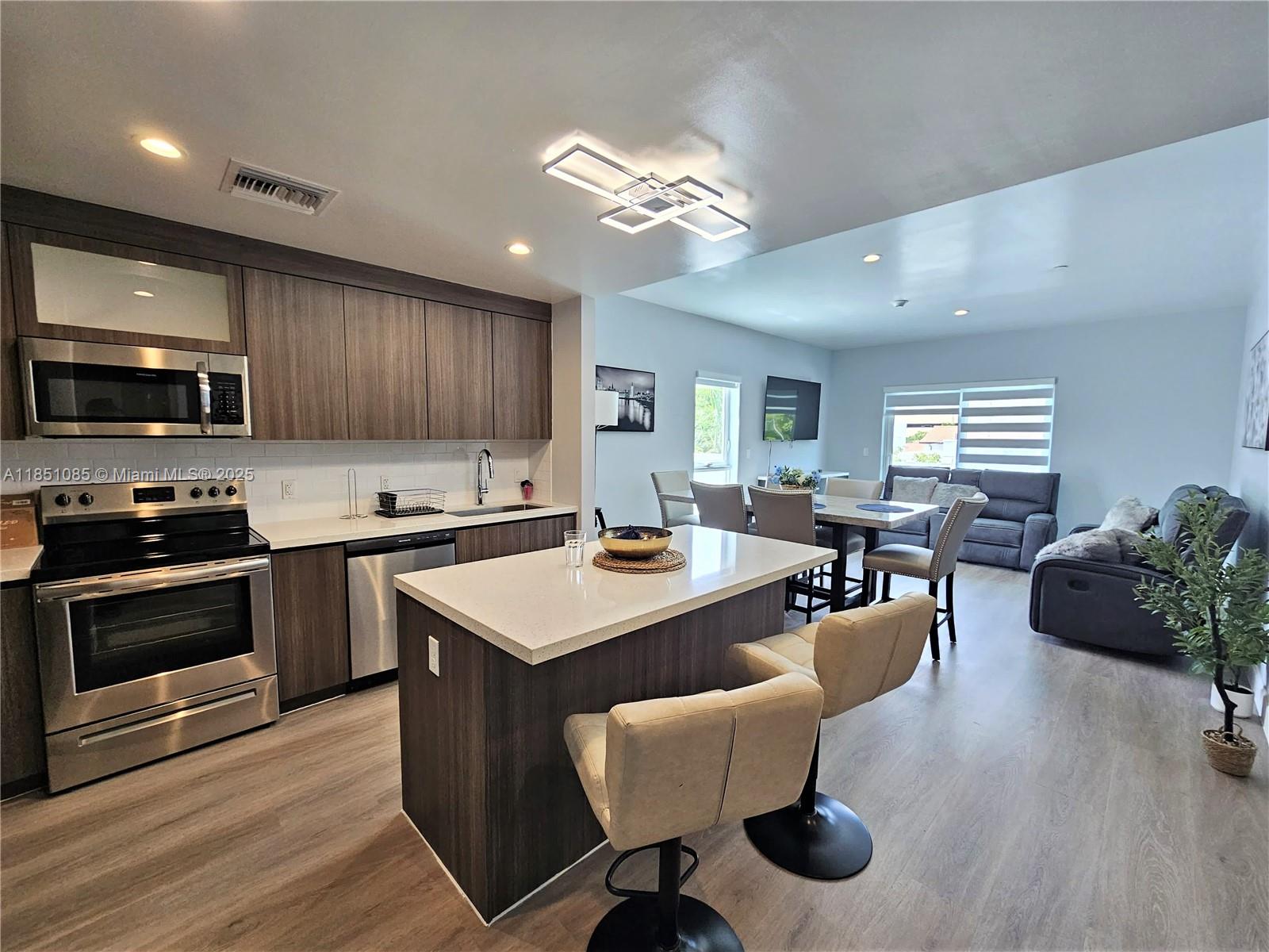 This beautifully furnished 2-bedroom, 2-bath apartment in a boutique condominium is bathed in natural light, offering a perfect blend of style and comfort. Featuring modern cabinetry, quartz countertops, and luxury wood laminate flooring, this unit is in pristine condition. Enjoy a spacious balcony and terrace, ideal for AIRBNB or daily rentals. Located near downtown Hollywood, with easy access to Aventura, Bal Harbour, Ft. Lauderdale, Miami, and the Hard Rock Hotel & Casino, plus just 15 minutes from the airport and close to the beach and I-95. Priced to sell – don’t miss out on this incredible opportunity to live in or rent out!----------UNIT RENTED TILL 8/12/2026, PAYS $3,000.00 PER MONTH - TENANT CAN SHOW THE UNIT Weekdays after 7pm
