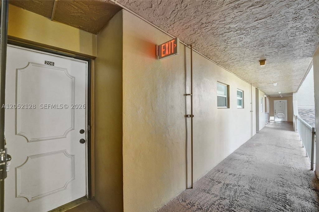 Photo of 9480 Tangerine Pl #206, Davie, FL 33324 (MLS # A12052128)