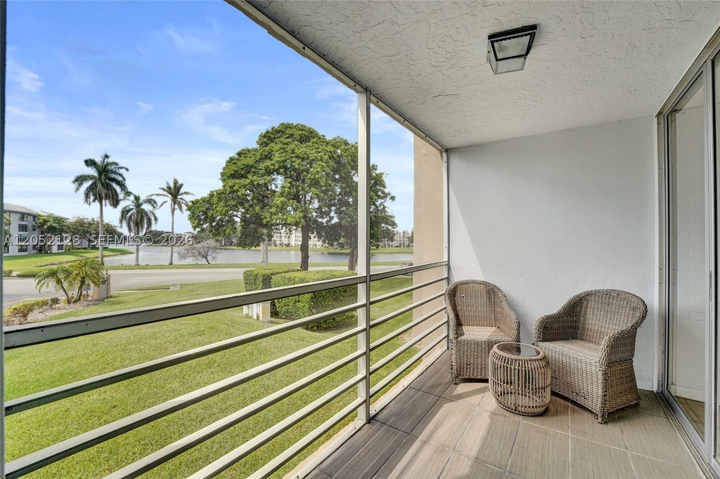 Photo of 9480 Tangerine Pl #206, Davie, FL 33324 (MLS # A12052128)