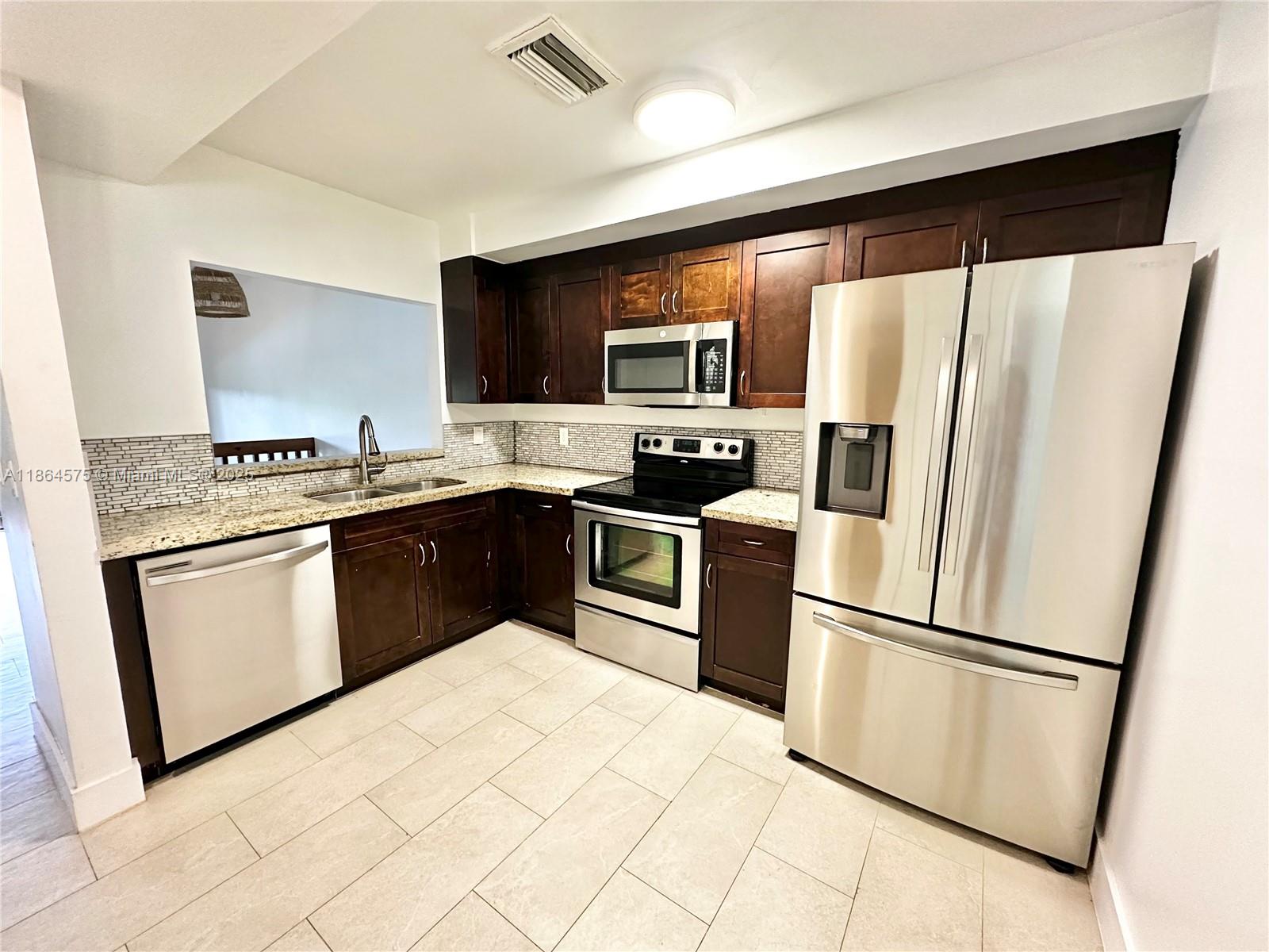 Waterfront 3 bedroom, 2 bathroom townhouse situated on a tranquil lake featuring soaring high ceilings and an open-concept design that fills the home with natural light. This peaceful and spacious property features a beautifully updated kitchen with granite countertops, stainless steel appliances, contemporary bathrooms, a private screened-in porch overlooking the serene lake, walk-in closets, ample storage space, smart thermostat, keypad entry lock as well as a laundry room with Samsung washer/dryer. Located in an A-rated school district, this community provides fantastic amenities including a lakefront pool, tennis courts, and pickleball courts. Convenience is key with assigned parking directly in front of your door plus plenty of guest parking for visitors.