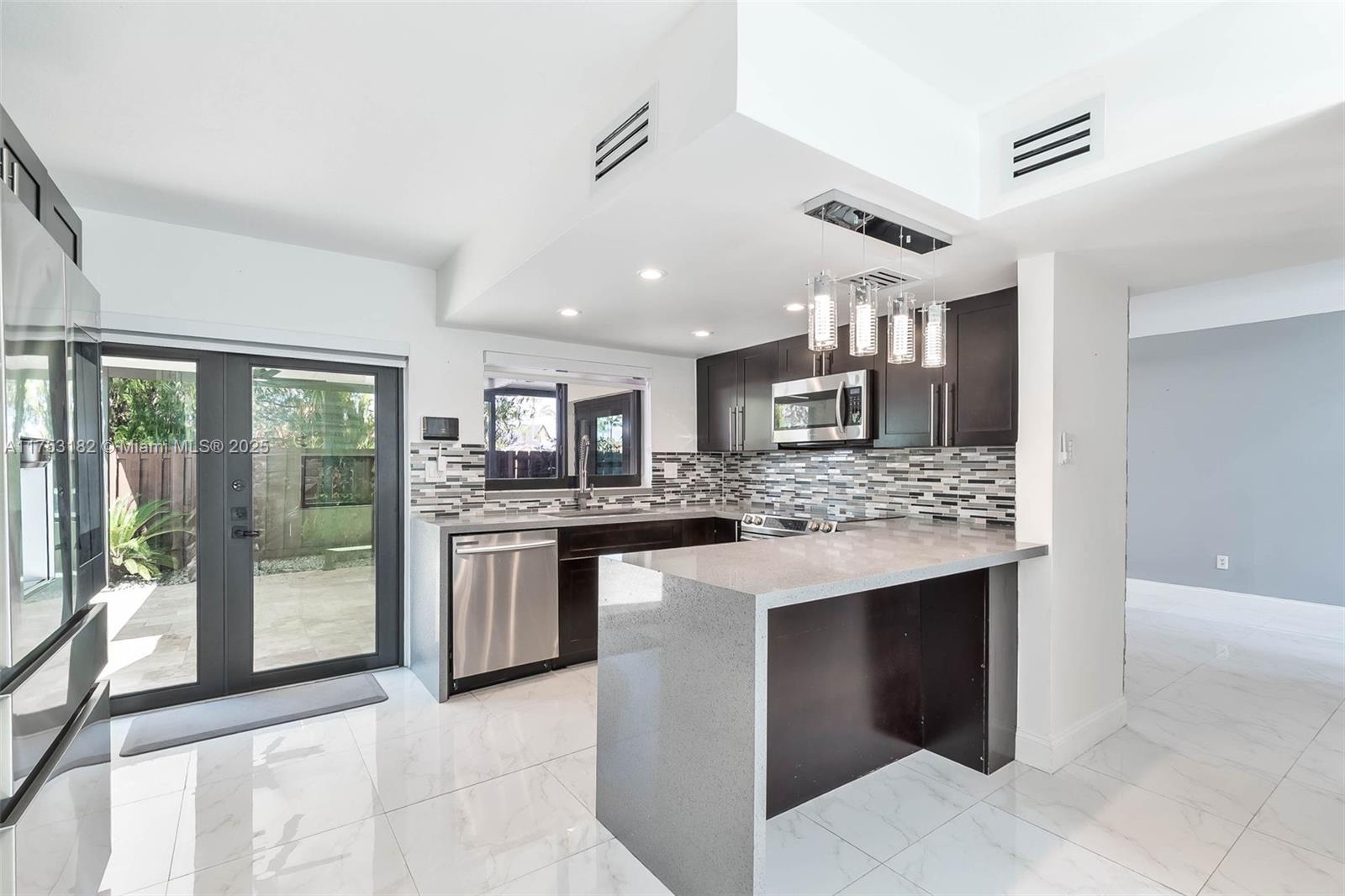 Welcome to this beautifully renovated 3-bedroom, 2.5-bath townhouse located in the heart of Fontainebleau, one of Miami’s most convenient and sought-after neighborhoods. This centrally located gem offers easy access to Miami International Airport, FIU, top shopping destinations, dining, and all major expressways — putting everything you need just minutes away. Step inside to discover a modern interior with contemporary finishes throughout. The open-concept living area flows seamlessly into a spacious kitchen, perfect for hosting and everyday living. Enjoy your private patio terrace, ideal for entertaining, relaxing, or outdoor dining. This is the perfect place to call home — combining modern style, comfort, and unbeatable convenience. Storage unit and TV Wall in patio not included.