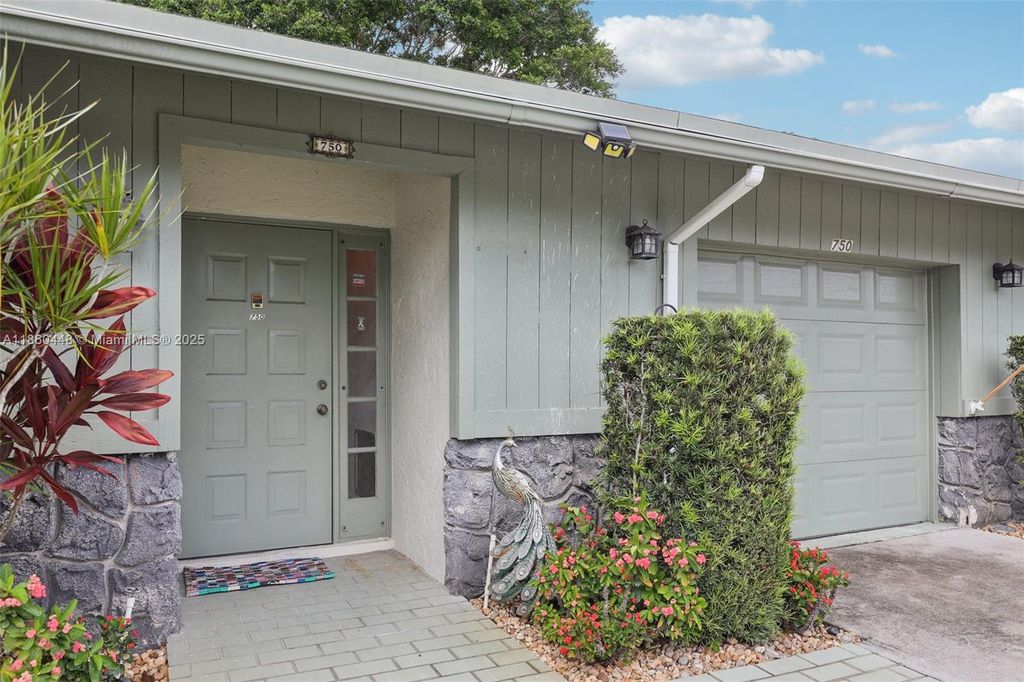 Photo of 750 NW 23rd Ln, Delray Beach, FL 33445 (MLS # A11860448)