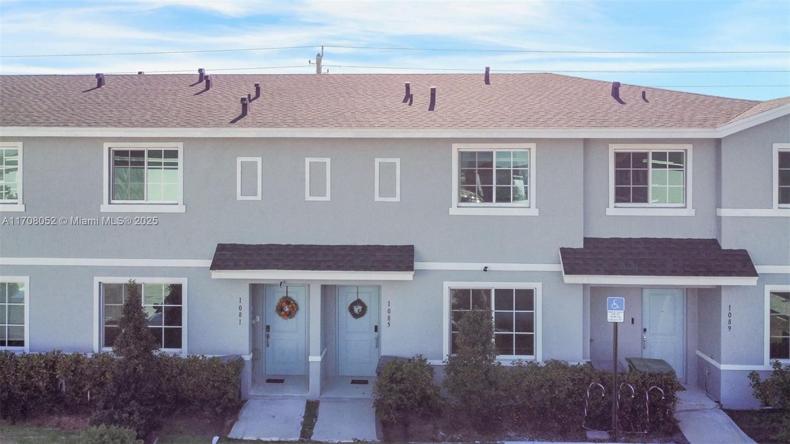 Like new, modern townhome built in 2023. Home features a spacious floorplan, gourmet kitchen with stainless steel appliances and granite countertops. One bedroom with full bath located on the main floor. Private fenced backyard with paved area for seating/entertaining. Upstairs features a large primary bedroom with walk in closet, ensuite bathroom with double sinks and walk in shower. In unit washer/dryer. 2 parking spaces with guest parking available. Townhouse is located in a quiet private neighborhood with children's playground. Very low monthly HOA. Great location with easy access to FL Turnpike. Only 30 mins to the Key Largo!