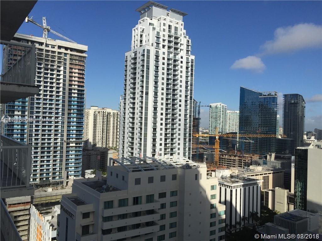 Don't miss this opportunity to enjoy living in a large one bedroom condo-unit tastefully furnished, just bring your tooth brush. Unit features wood floor throughout, washer & dryer inside unit, big balcony with panoramic city and bay views, open kitchen with granite counter tops and plenty of closets. Located in a full-amenity building with concierge service, valet parking, swimming pools, spa, recreational salon. Best location of Brickell, walking distance to malls, Brickell Village Center, shoppings, restaurants, and only minutes driving to Coconut Grove, Coral Gables, Key Biscayne and South Beach.