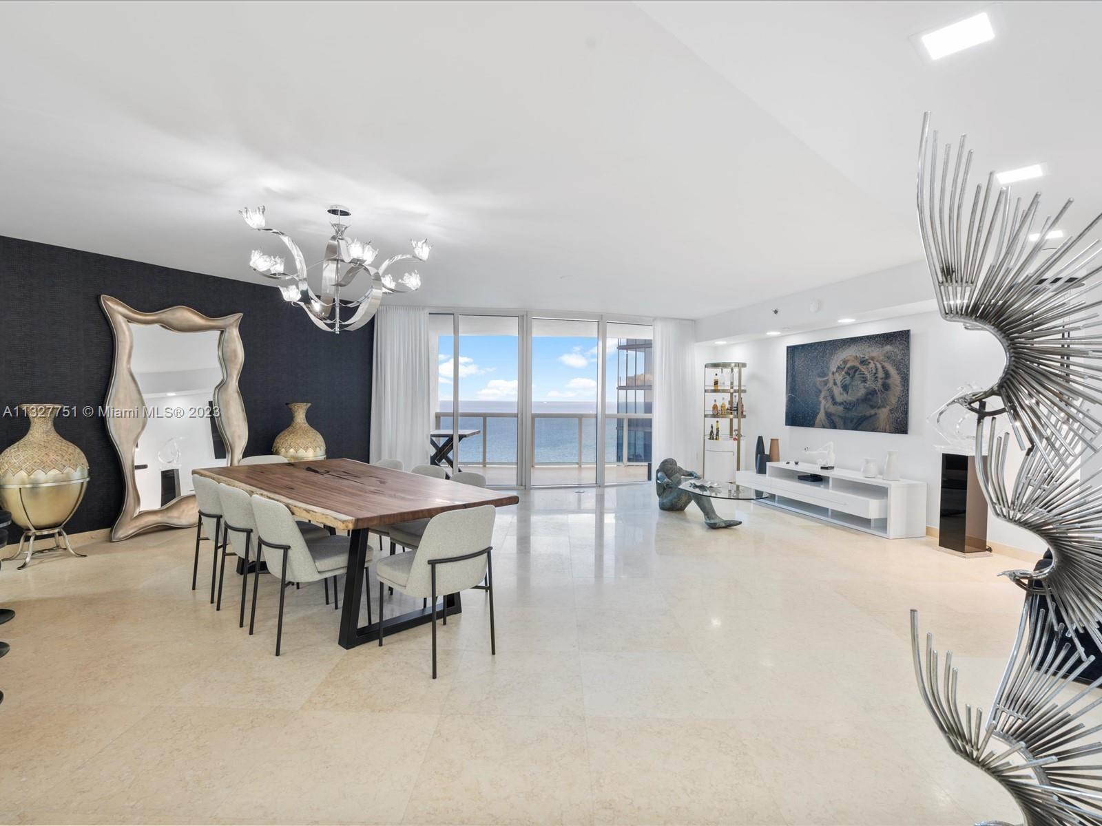 Impeccably updated unit in Sunny Isles Beach Ocean Four Condominium. Enjoy east unobstructed ocean views from your living area and west city, intracoastal and sunset views from your bedrooms' balcony. This large two bedroom, two and a half bath home is just amazing! Floor to ceiling impact windows, laundry room, one assigned parking space are just a few of the features and the pictures speak for themselves. Building amenities include 24/7 valet parking, full beach service, exercise room and hot tub, relaxing pool just to name a few.
