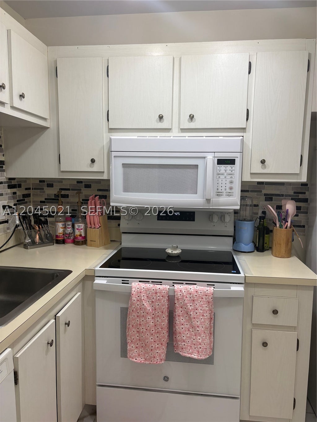 Photo of 9340 Lagoon Pl #202, Davie, FL 33324 (MLS # A12045021)