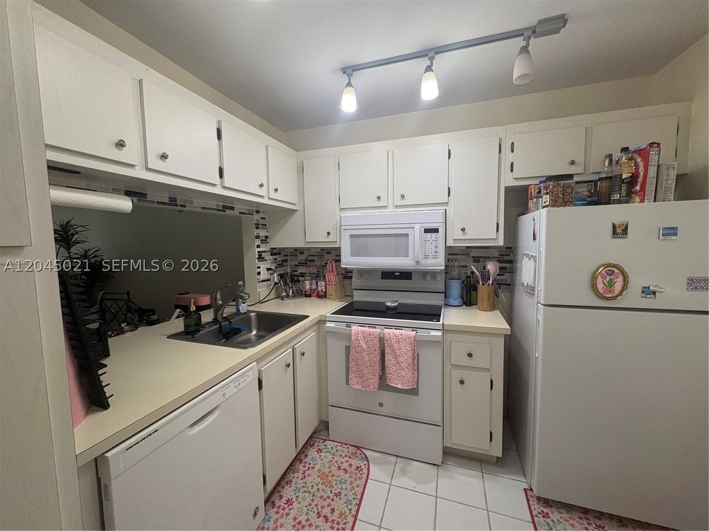 Photo of 9340 Lagoon Pl #202, Davie, FL 33324 (MLS # A12045021)