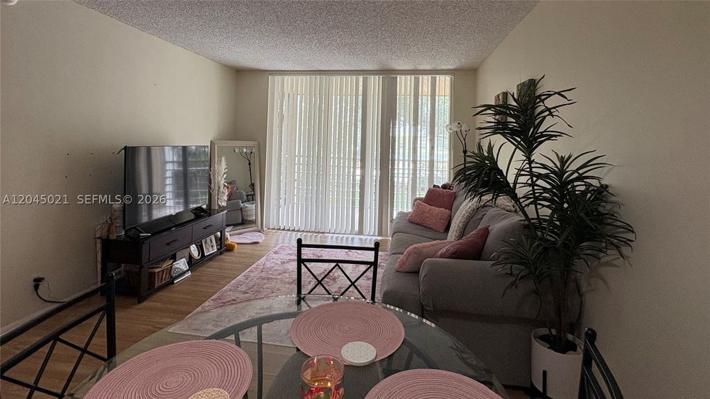 Photo of 9340 Lagoon Pl #202, Davie, FL 33324 (MLS # A12045021)