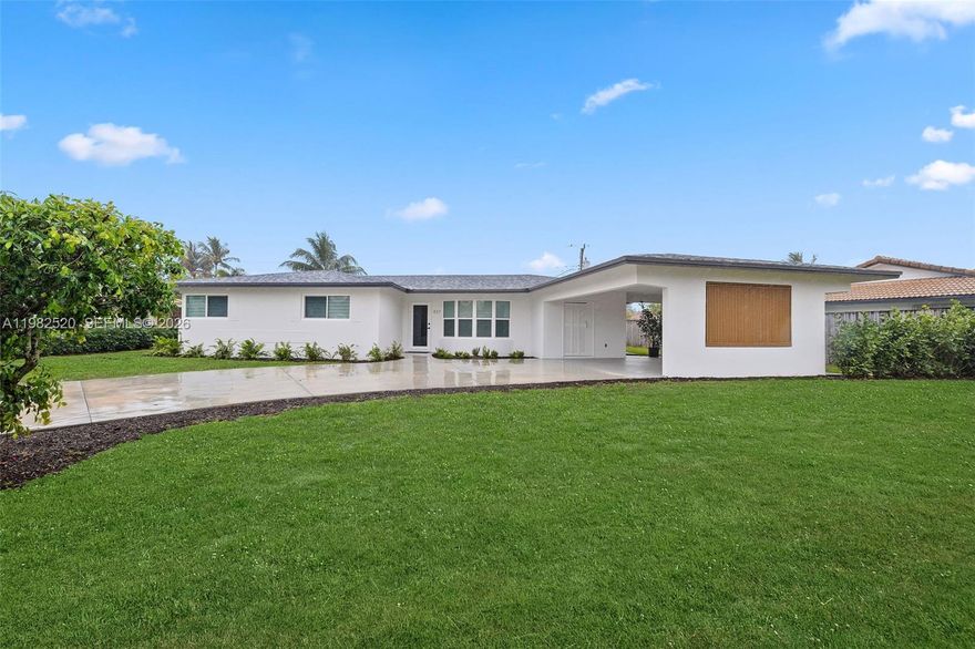 Stunning Designer-Renovated Pool Home Located in the Addison Mizner school district, East of I-95 – Move-In Ready Luxury Living. Charming 3-bedroom, 2-bath residence offering modern luxury and effortless South Florida living just minutes from beaches, shopping, and top dining. The bright open-concept design features a spectacular Italian-style kitchen with exotic quartz countertops, dramatic waterfall island, sleek cabinetry, and high-end stainless steel appliances including a wall oven. Major upgrades include impact windows and doors, new A/C with updated ductwork and modern vents, elegant LED lighting, washer and dryer, and a brand-new roof (2026). The spacious primary suite offers a comfortable, beautifully designed bathroom, custom closet, and private pool access.
Enjoy your private tropical oasis with upgraded Diamond Brite pool, lush landscaping, irrigation system, expansive terrace for entertaining, and spacious carport.