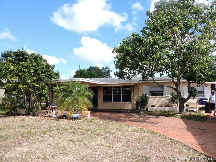 Spacious 4 Bedroom and 3 Bath Home with a Covered Carport ~ Tile Flooring Throughout ~ Large Eat In Kitchen with Island ~ Split Bedroom Floor Plan ~ Family Room ~ Huge Stamped Driveway ~ Great for a Large Family ~