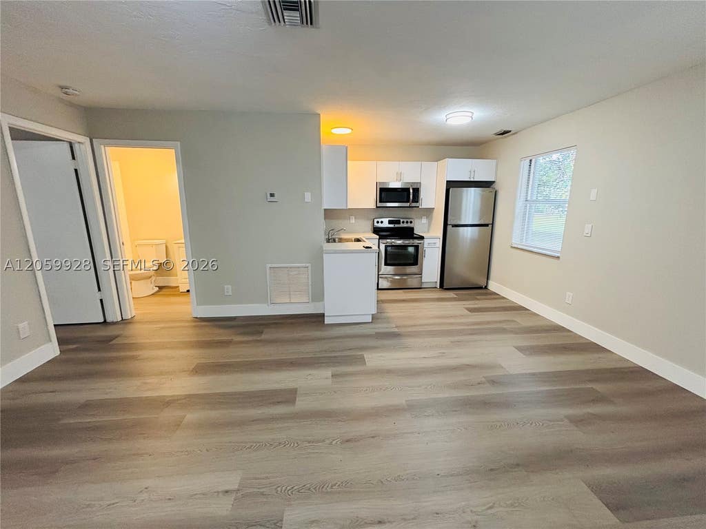 Photo of 1011 SW 8th St #D, Hallandale Beach, FL 33009 (MLS # A12059928)