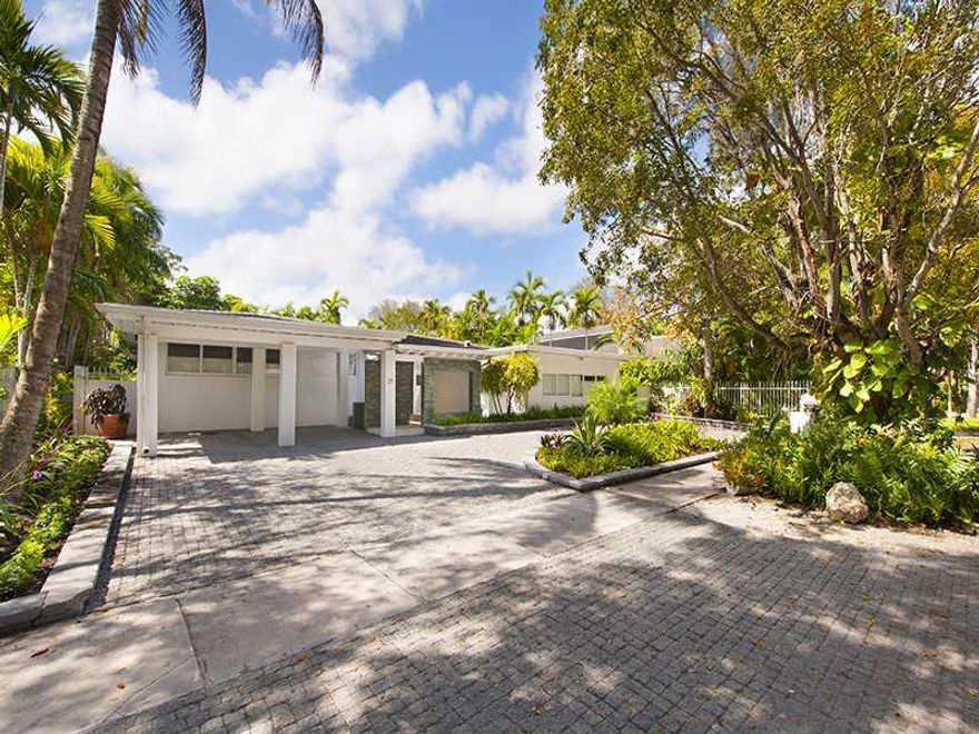 Another North Grove gem!  This beautifully renovated pool home has a wonderful floor plan and is perfect  for families and entertaining.  Enter through custom doors to a spacious, open living area.  Hardwood and marble floors throughout.  New roof, impact  windows, decking, pavers, doors, wonderful new baths, a formal dining room, tons of closet space, solar heated pool and more.  Home is in the quiet interior of Bay Heights, a fantastic location! A must see. Call listing agent.