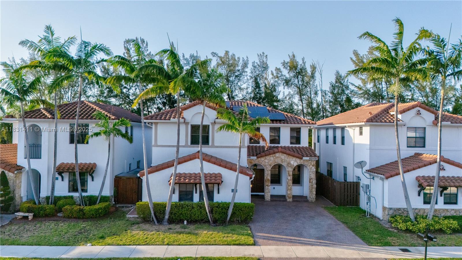 Beautifully maintained 4-bedroom, 3/1-bath two-story home in the exclusive Las Ramblas community. Features include solar panels, porcelain tile flooring downstairs, and dark wood flooring upstairs. The open layout offers a spacious living room and a gourmet kitchen with a breakfast area. The second floor includes an oversized master suite with a private balcony with a water view, walk-in closet, and luxurious en-suite bath, plus a small suite and two additional bedrooms with a shared Jack and Jill bathroom. Enjoy a private backyard retreat with a pool, jacuzzi, pergola, and stunning water views. Community amenities include 24/7 security, clubhouse, gym, business center, tennis courts, and playground. Conveniently located near Dolphin Mall, Miami International Airport, and major highways.