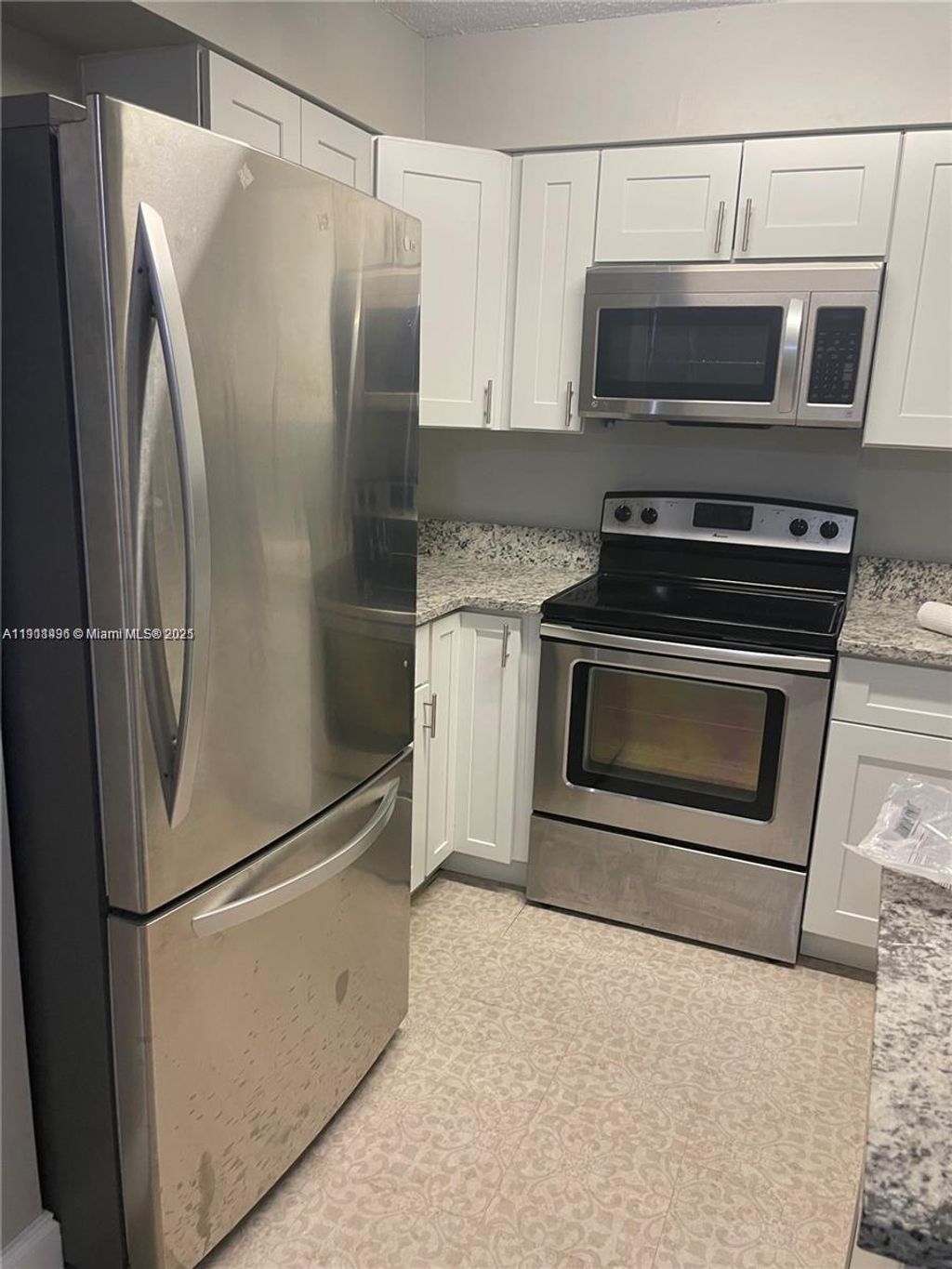 Photo of 4513 Treehouse Ln #11C, Tamarac, FL 33319 (MLS # A11911496)