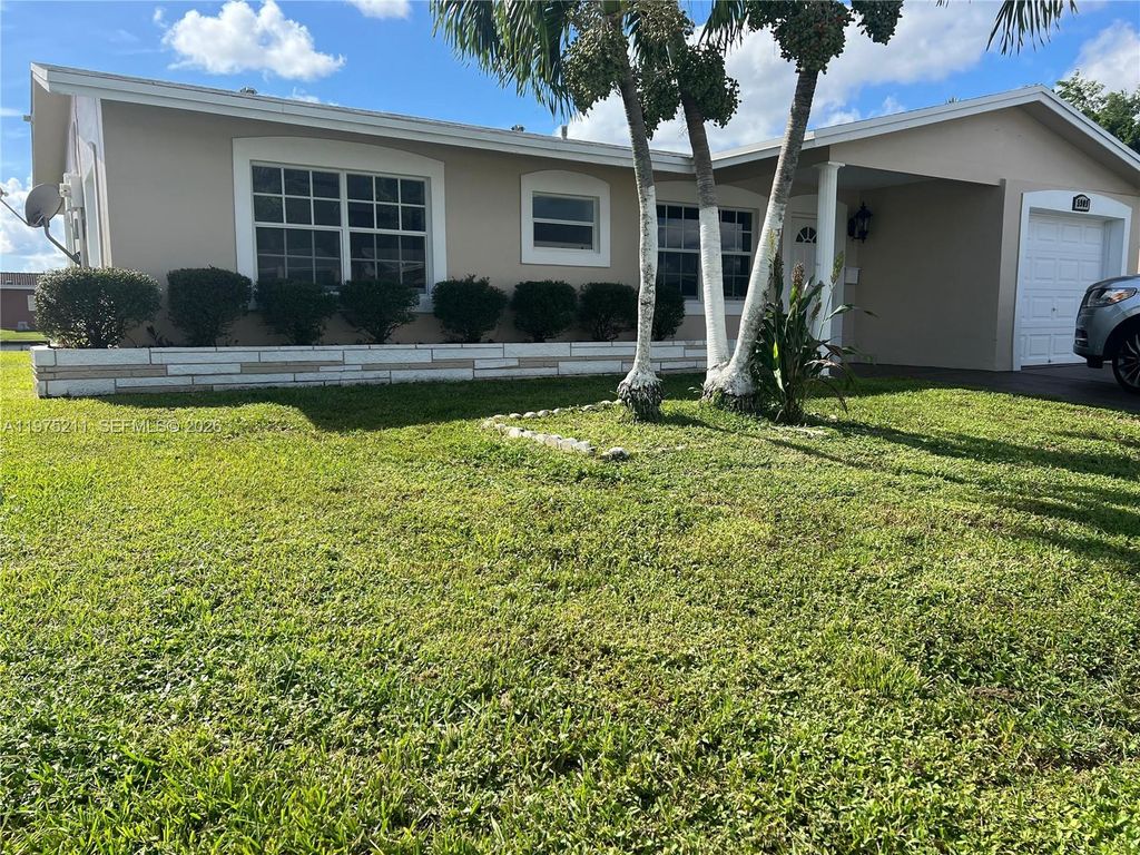 Photo of 5909 NW 67th Ave, Tamarac, FL 33321 (MLS # A11975211)