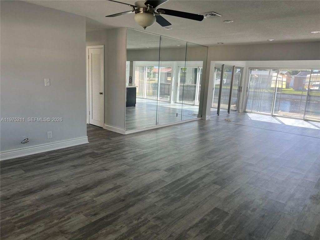 Photo of 5909 NW 67th Ave, Tamarac, FL 33321 (MLS # A11975211)