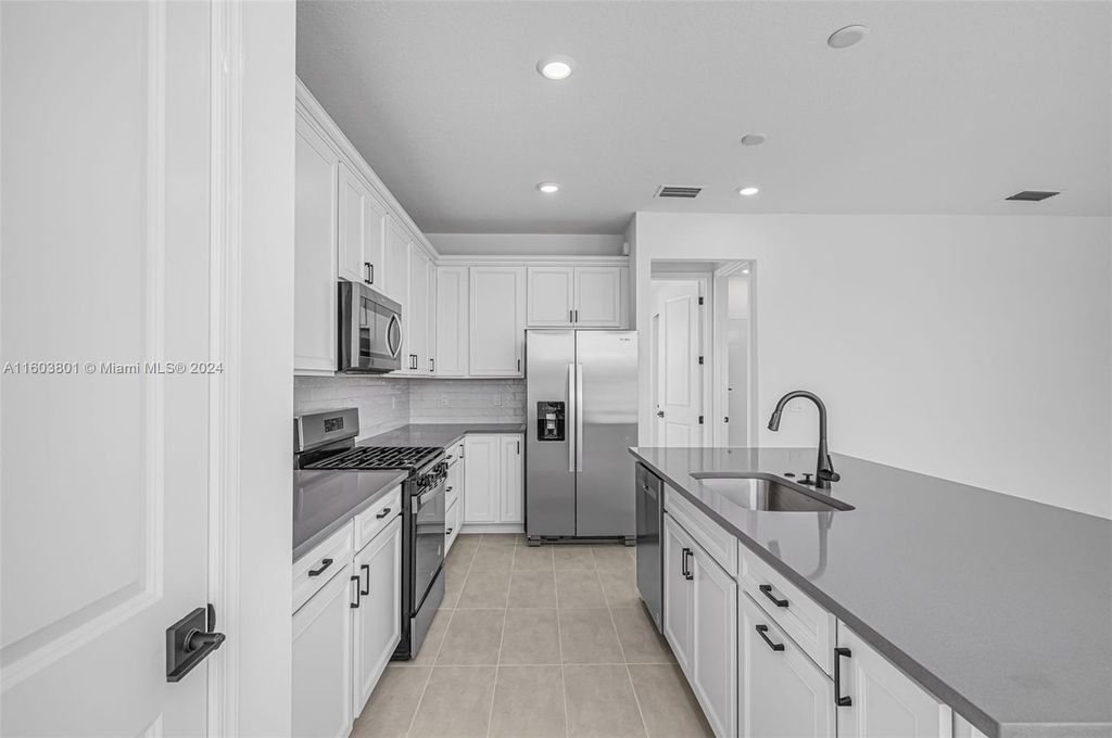Photo of 10615 SW Morning Glory Dr, Port Saint Lucie, FL 34987 (MLS # A11603801)