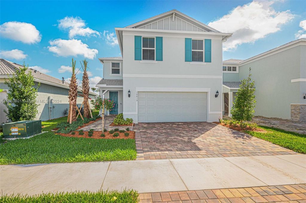 Photo of 10615 SW Morning Glory Dr, Port Saint Lucie, FL 34987 (MLS # A11603801)