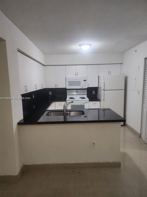 Photo of 4560 NW 107th Ave #207-12, Doral, FL 33178 (MLS # A11980060)