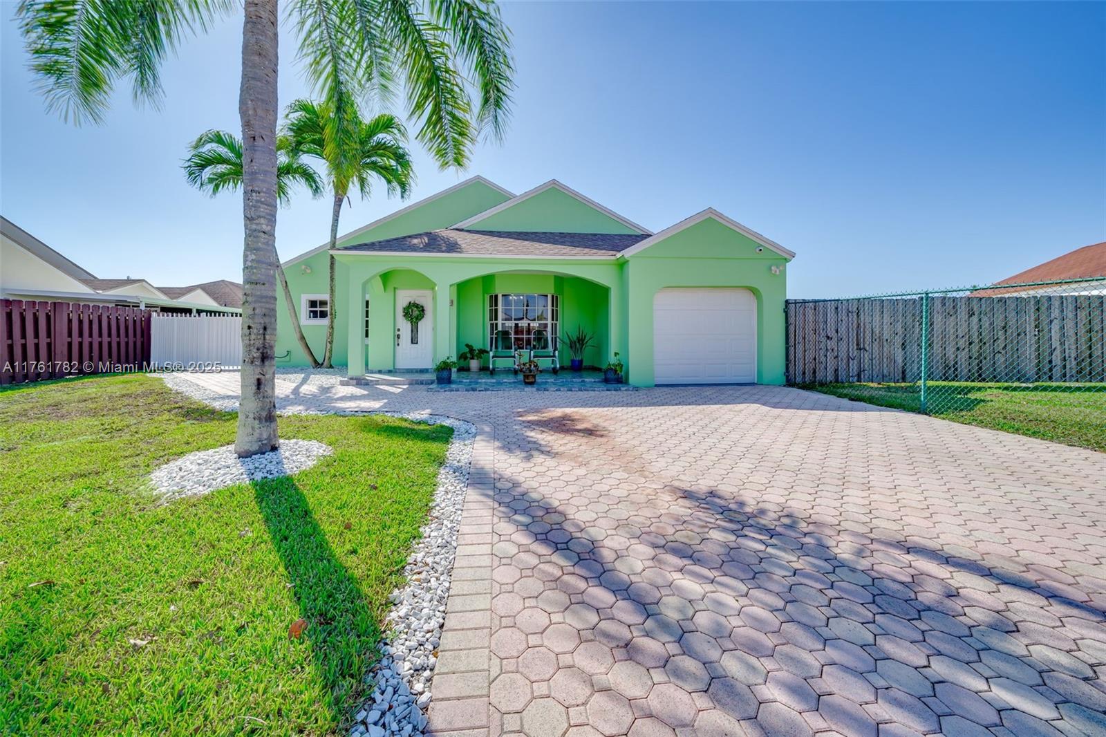 Beautiful corner residence located in Southwest Miami-Dade. This spacious 3/2 boasts a gorgeous driveway with Chicago HEX style pavers, an oversize front entrance foyer, and a brand new exterior stucco update and paint job. Enjoy peace of mind with a fairly new 3 year old roof, upgraded impact garage door, new central A/C, and a tankless water heater. Enjoy an extremely spacious open interior floor-plan with volume ceilings and an oversize family room. Plenty of side space to store a boat or RV, and a large backyard with plenty of space for a brand new pool. A MUST SEE!