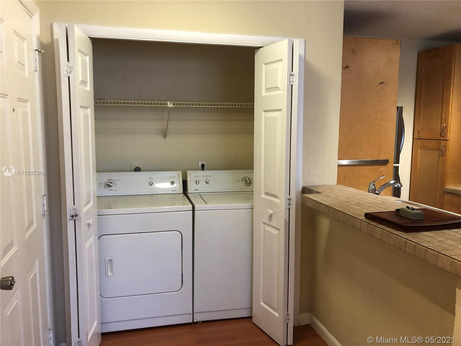 Updated and spacious apartment. This top floor apartment is immaculate and features wood floors, fabulous kitchen including 42'' wood cabinets, tile counters, under counter lighting and stainless steel appliances, vaulted ceilings, screened covered patio. Gated community with 2 pools, tennis courts, volleyball courts, gym, car wash and clubhouse.