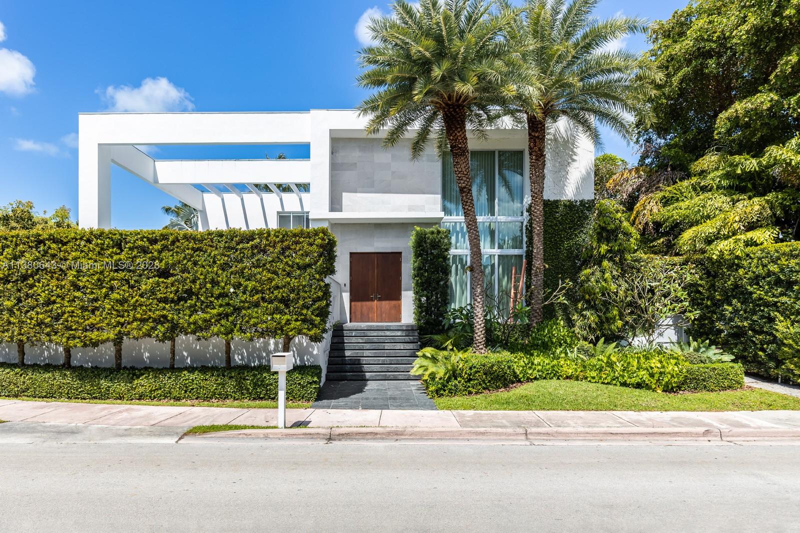 Captivating, Modern home on a corner lot in the exclusive island of Key Biscayne. Acclaimed design team: Bruno Elias Ramos(Architect), Robert Rionda(Interiors) & Michael Thiel(Landscape Design). Dramatic, light-filled living spaces feature double-height ceilings, terrazzo floors, smart home technology, surround sound system and exquisite custom details throughout. Stunning kitchen w/ high-gloss Italian cabinetry, quartz & stainless-steel countertops + Sub-Zero/Gaggenau appliances. Incredible primary suite offers sitting area, private balcony & spa-like bath. Solar panels lower electric bill by 50%. Enjoy views of the Miami skyline from the roof-top terrace w/ enclosed office area and a playroom. Ultra-private, landscaped garden, covered terrace, summer kitchen & heated infinity pool & spa.