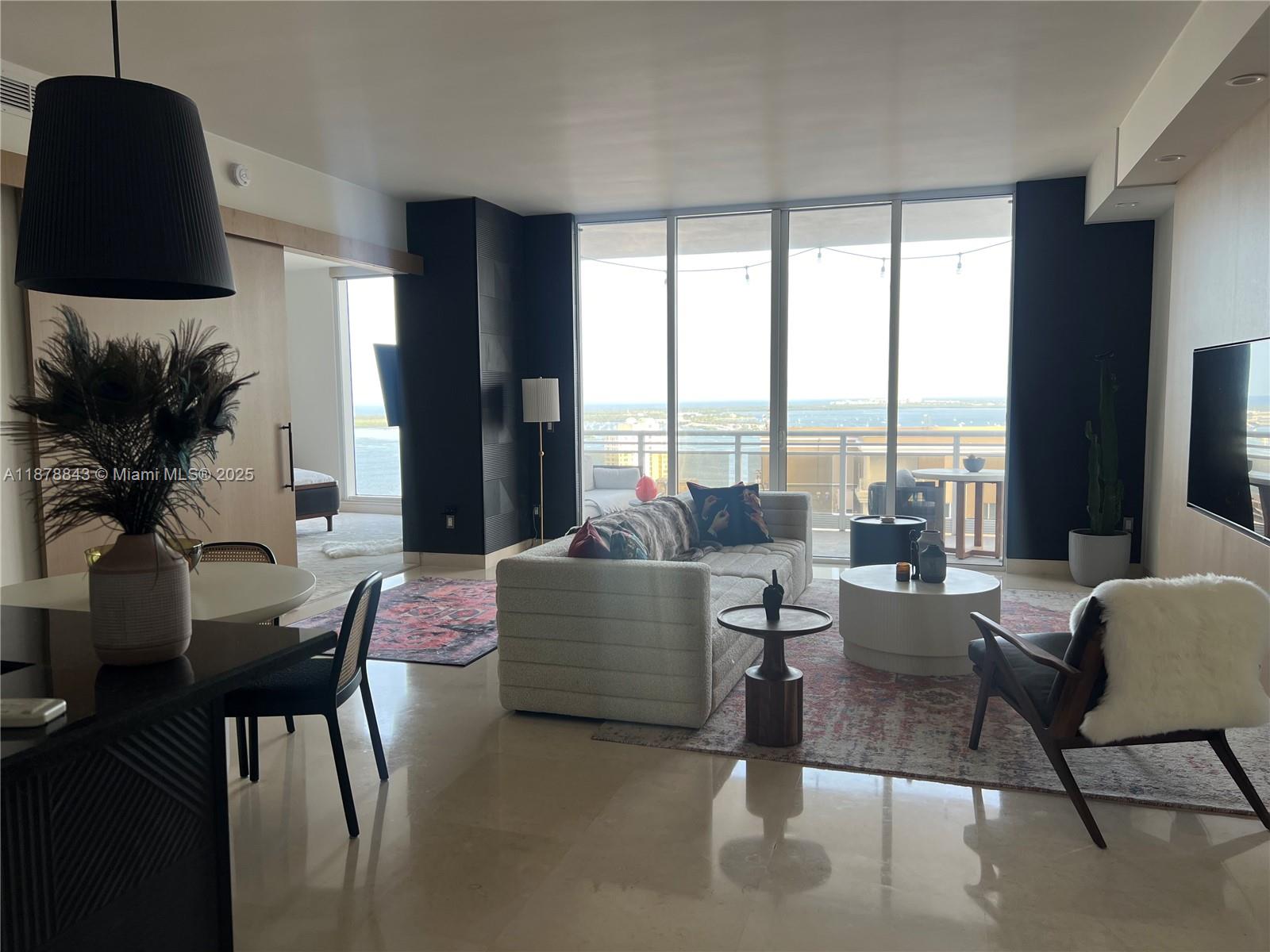 RENOVATED LOWER PENTHOUSE UNIT IN THE PRESTIGIOUS CARBONELL BUILDING. Ocean and bay views, high ceilings, fully furnished 1 bed/1.5 bath, 1,076SF living area. Your customer will greatly appreciate the exquisite decorated unit. Five star amenities 24/7 security, 2-story fitness center, heated waterfront resort-style pool, Jacuzzi, BBQ area, 2 tennis courts, indoor racquetball & basketball court, party room and gorgeous bay walk, kids playground and new restaurants on the island.