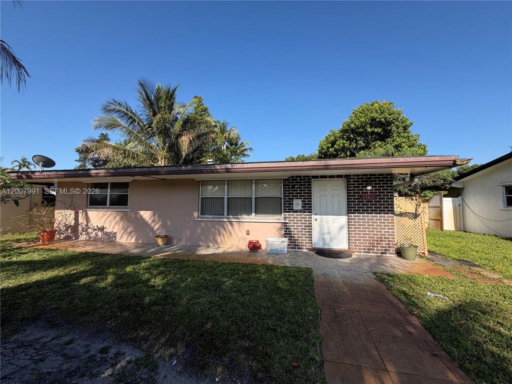 Photo of 1160 NW 77th Way #1160, Pembroke Pines, FL 33024 (MLS # A12007991)