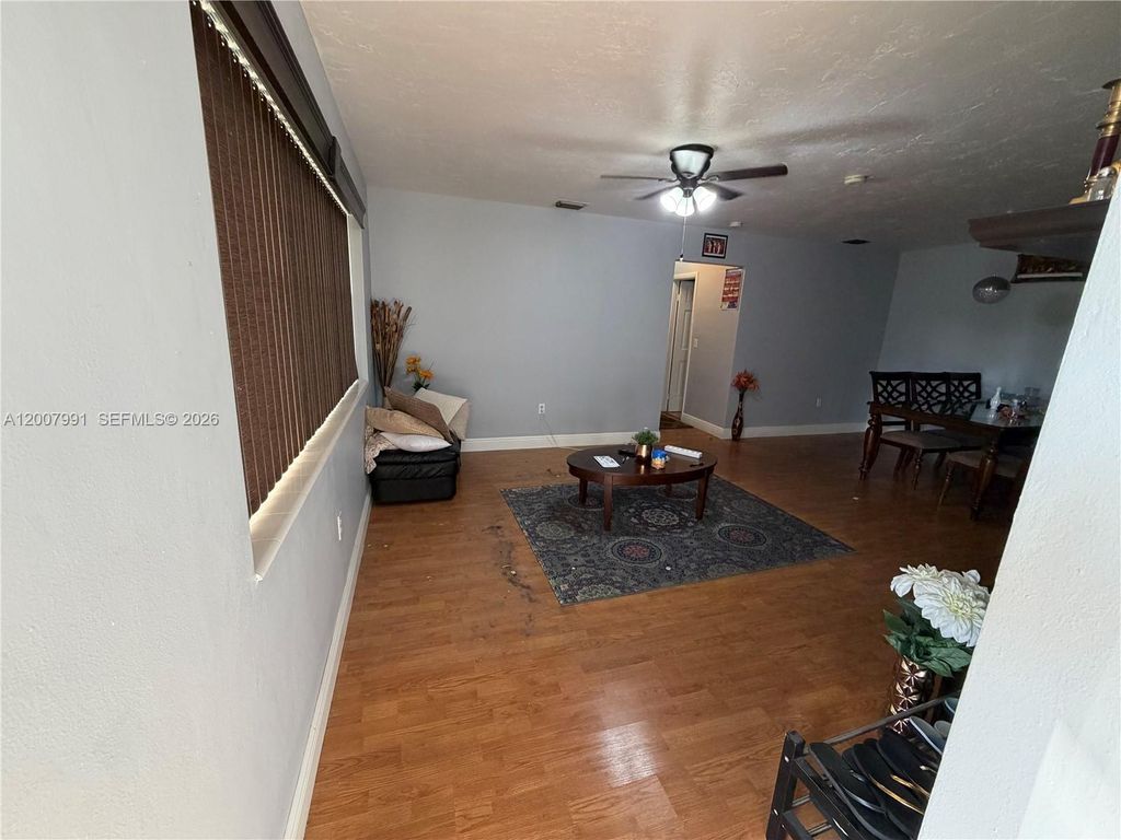 Photo of 1160 NW 77th Way #1160, Pembroke Pines, FL 33024 (MLS # A12007991)