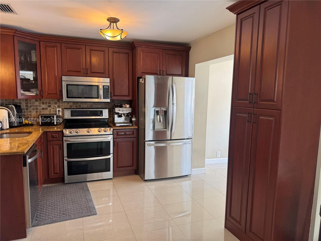 Photo of 1460 NE 30th Ct, Pompano Beach, FL 33064 (MLS # A11990897)