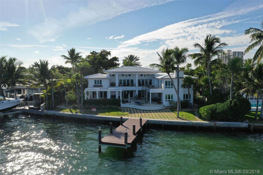 Bran new modern white concrete tile roof & exterior white paint job transform the look & feel of this bayfront estate. Exemplary gated home on the wide bay w 120ft of unobstructed views & downtown MIA skyline. Privacy gated entrance w/ sweeping driveway & plenty of parking. 2-level patio w pool, pergola, & summer kitchen. Grand family room w volume ceilings is perfect for entertaining w/ private exit to second floor terraces. Grand family room has wet bar, custom built-ins, & reclaimed chestnut hardwood flooring. XL Master suite has his/hers walk-ins, spa bath, & private access to outdoor terrace. Chef's kitchen has gas cooking & adjacent dining room. Grand foyer entry w/ bonus dining room off courtyard. Full back-up generator and new boat dock. Private garden, exercise room w/ dry sauna.