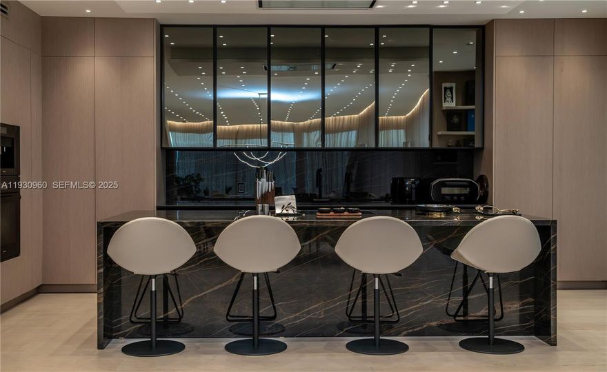 Recipient of the prestigious 2025 KBIS Award for Best Millwork, Kitchen, and Bath, Residence 4A at The Palace is a truly one-of-a-kind offering that sets a new benchmark for luxury living. This 3-Bedroom, 3.5-Bathroom residence showcases extraordinary craftsmanship, featuring bespoke millwork by Laura Meroni, a Pittori kitchen, and an uncompromising level of design and detail throughout.

Completed two years ago, the residence underwent a comprehensive, full-scale architectural transformation—not a superficial renovation. All interior walls were removed, leaving only the exterior structure, allowing for a completely fresh reimagining of over 3,000 square feet of living space. Ceilings were raised to  enhance light, openness, and architectural impact.

The private elevator opens directly into the residence’s exclusive foyer, offering complete privacy and a grand arrival experience. The home is further enhanced by all-new electrical panels and wiring, a new HVAC system, and impact-resistant glass, delivering modern efficiency, comfort, and peace of mind.

No expense was spared, and budgetary limitations were never a consideration in the thoughtful redesign of this exceptional residence. There is simply no comparable home at The Palace. This is a rare opportunity to acquire a masterfully curated residence where elegance, innovation, and craftsmanship converge. A must-see in person to fully appreciate its exceptional quality and refinement.