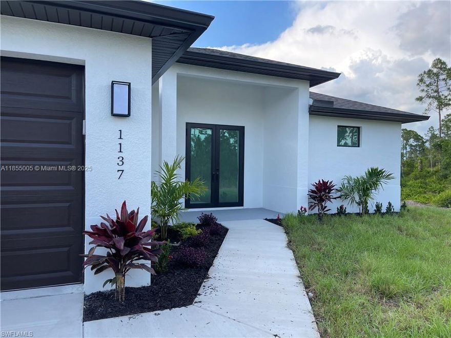 Welcome to your dream home in Lehigh Acres! This stunning single-family home boasts 3 bedrooms, 2 bathrooms, and a spacious 2-car garage. The modern finishes include granite counters, stainless steel appliances, and high impact windows. With high ceilings and a canal waterfront view, this home offers a luxurious and peaceful retreat. The best part? No HOA fees or CDD taxes to worry about. Don't miss out on the opportunity to own this beautiful property in a desirable location. Make this house your home today!